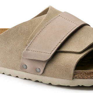 Taupe Birkenstock Kyoto sandals with nubuck/suede upper, adjustable hook and loop closure, and comfortable footbed.