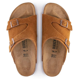 Mink Birkenstock Zurich sandals with soft suede upper, adjustable metal pin buckles, and contoured footbed.