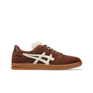 ASICS SKYHAND OG in reddish brown and oatmeal with suede panels, gum outsole, and retro handball-inspired silhouette.
