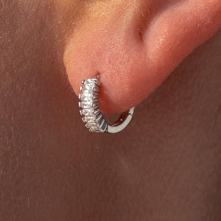 Silver huggie earrings with cubic zirconia stones and clasp