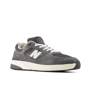 Andrew Reynolds NB Numeric 933 skate shoes in heritage grey with ABZORB midsole and classic running-inspired silhouette.