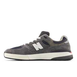 Andrew Reynolds NB Numeric 933 skate shoes in heritage grey with ABZORB midsole and classic running-inspired silhouette.