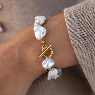 Gold bracelet with shell coating and toggle clasp closure