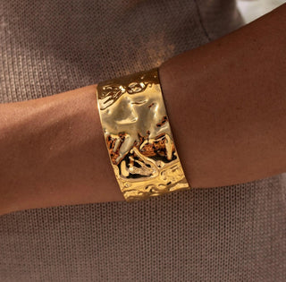 Gold open-ended cuff bracelet with polished stainless steel finish
