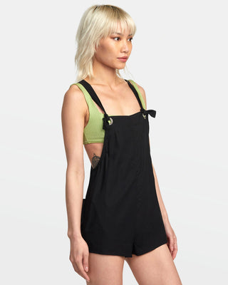 RVCA Women's black coverup romper with on-seam and back patch pockets.