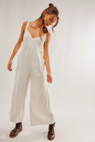 Free People one-piece in Snowbell, sweetheart neckline, pleated bust, wide-leg fit, open back with tie closures.