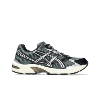 ASICS GEL-1130 sneaker in steel grey and black with mesh upper, GEL® heel cushioning, and TRUSSTIC® support system.
