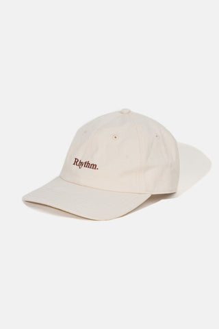 Rhythm Essential Cap in Vintage White, 100% cotton twill, six-panel, curved peak, adjustable strap, embroidered logo.