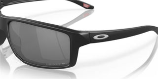 Oakley Gibston Prizm Polar Sunglasses in Matte Black with Prizm Black Polar lenses, high-wrap O Matter lightweight frame with hat compatible temple design, extended periphery, three-point fit for precise optical alignment, 11% light transmission grey base lens optimized for bright light