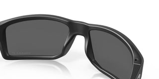 Oakley Gibston Prizm Polar Sunglasses in Matte Black with Prizm Black Polar lenses, high-wrap O Matter lightweight frame with hat compatible temple design, extended periphery, three-point fit for precise optical alignment, 11% light transmission grey base lens optimized for bright light