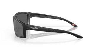 Oakley Gibston Prizm Polar Sunglasses in Matte Black with Prizm Black Polar lenses, high-wrap O Matter lightweight frame with hat compatible temple design, extended periphery, three-point fit for precise optical alignment, 11% light transmission grey base lens optimized for bright light