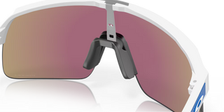 "Oakley Sutro Lite sunglasses in Matte White frame with Prizm Sapphire lenses — lightweight shield sport sunglasses with blue mirror finish and UV400 protection"