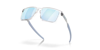 Oakley Exchange Sun Prizm Polar Sunglasses in Polished Clear with Prizm Deep Water Polar lenses, mixed material O Matter front with stainless steel temples and B1B grip textured Unobtainium earsocks, 12% light transmission rose base lens optimized for bright light and water conditions