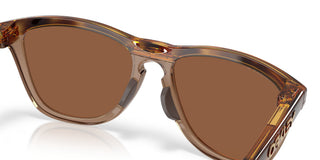 Oakley Frogskins Range XL Prizm Polar Sunglasses in Brown Tort and Brown Smoke with Prizm Tungsten Polar lenses, O-Matter injection molded thermoplastic XL frame with Unobtainium nosepad, 14% light transmission bronze base lens optimized for bright light, classic 1980s Frogskins silhouette engineered for larger heads