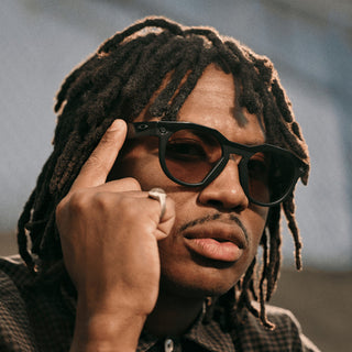 Oakley Meta HSTN Transitions smart glasses in Black with Transitions Amethyst lenses, Meta AI, camera, and audio.