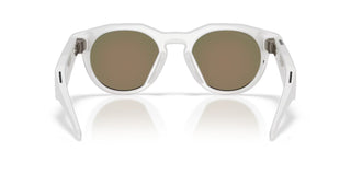 Oakley Meta HSTN smart glasses in Warm Grey with Prizm Ruby lenses, Meta AI, camera, and audio.