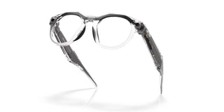 Oakley Meta HSTN Transitions smart glasses in Clear with Transitions Grey lenses, Meta AI, camera, and audio.