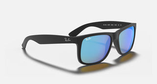 Ray-Ban Justin Sunglasses RB4165 in Matte Rubber Black with Blue Mirror Flash lenses, square rectangle nylon frame with rubberized finish and black temples, 54mm lens width, 43.9mm lens height, 145mm temple length, Wayfarer-inspired bold style