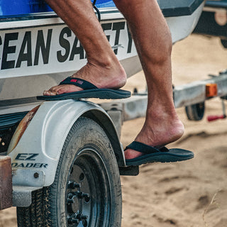 OluKai 'Ohana Men's Beach Sandals in Black/HLA, water-resistant synthetic straps with quick-drying jersey knit lining, soft nylon toe post, anatomically contoured footbed, and non-marking rubber outsole