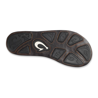 Olukai Mea Ola leather sandals in Tan and Dark Java with whipstitched straps and laser-etched footbed artwork.