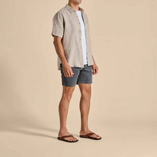 Olukai Mea Ola leather sandals in Tan and Dark Java with whipstitched straps and laser-etched footbed artwork.