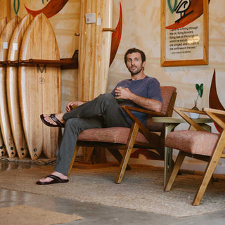 OluKai Mea Ola Leather Sandals in Dark Java/Dark Java — premium full-grain leather with canoe lash whipstitching, octopus laser-etched footbed, microfiber lining, and handsewn leather toe post
