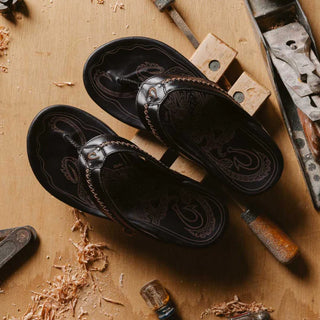 OluKai Mea Ola Leather Sandals in Dark Java/Dark Java — premium full-grain leather with canoe lash whipstitching, octopus laser-etched footbed, microfiber lining, and handsewn leather toe post