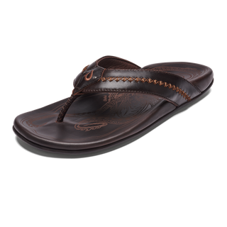 OluKai Mea Ola Leather Sandals in Dark Java/Dark Java — premium full-grain leather with canoe lash whipstitching, octopus laser-etched footbed, microfiber lining, and handsewn leather toe post