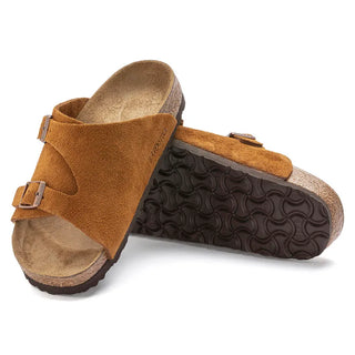 Mink Birkenstock Zurich sandals with soft suede upper, adjustable metal pin buckles, and contoured footbed.