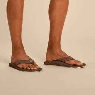 Olukai Ulele men's beach sandals, water-resistant, enhanced grip, sneaker-like support, modern style.