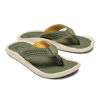 Side view of an OluKai Ulele sandal in Shadow Green with laser-cut straps, mustard-colored lining, and a textured cream sole.