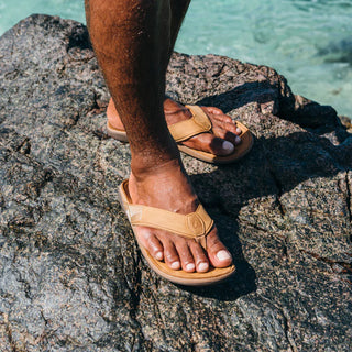 Olukai Tuahine Leather Beach Sandal in Toffee/Toffee with waterproof design and Hawaiian-inspired stitching.