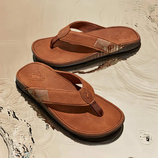 Olukai Tuahine Leather Beach Sandal in Toffee/Toffee with waterproof design and Hawaiian-inspired stitching.
