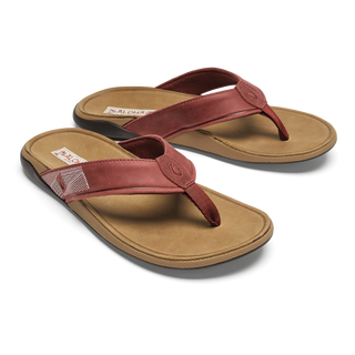 OluKai Tuahine Leather Beach Sandal in Red Ochre/Tan — waterproof full-grain leather with Hawaiian-inspired stitching, anatomically contoured footbed, and non-marking wet grip outsole