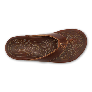 Side view of an OluKai Mekila sandal in Natural/Natural with brown leather straps, stitched edges, and decorative artwork across the footbed.