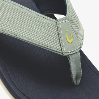 OluKai 'Ahi Kai Men's Beach Sandals in Seagreen/Trench Blue, NaluFoam cushioned midsole with secure strap design, quick-drying nylon toe post, and barnacle-inspired Wet Grip rubber outsole