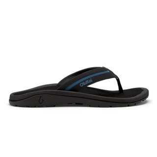 OluKai 'Ohana Pālua Men's Beach Sandals in Black/Slate Blue, synthetic split strap with jersey knit lining, signature 'Ohana compression-molded EVA footbed, and non-marking rubber coral-inspired lug outsole
