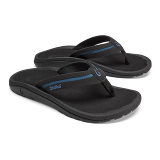 OluKai 'Ohana Pālua Men's Beach Sandals in Black/Slate Blue, synthetic split strap with jersey knit lining, signature 'Ohana compression-molded EVA footbed, and non-marking rubber coral-inspired lug outsole