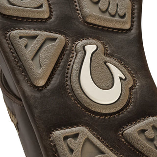 OluKai Mea Ola Mano leather sandals in Dark Java/Mustang with woven straps and shark-inspired etched detailing.