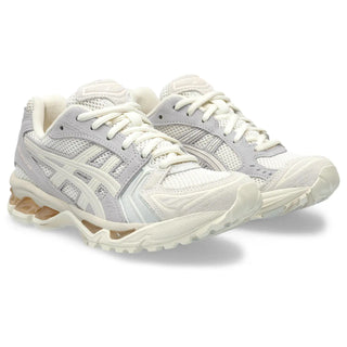 Women's GEL-KAYANO® 14 Cream/Blush: a modern reinterpretation of the 2000s classic with updated comfort and style.