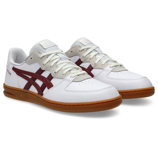 ASICS SKYHAND OG sneaker in white and brisket red with suede paneling, gum outsole, and retro handball-inspired design.