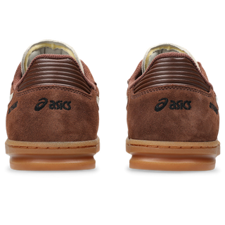 ASICS SKYHAND OG in reddish brown and oatmeal with suede panels, gum outsole, and retro handball-inspired silhouette.