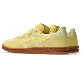 ASICS SKYHAND OG sneakers in wheat yellow and sunlight colorway with retro handball-inspired design, premium suede and mesh upper, and classic ASICS styling