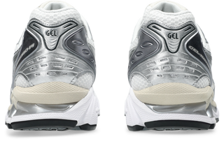 ASICS GEL-KAYANO 14 in White/Graphite Grey with layered upper and GEL cushioning.