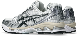 ASICS GEL-KAYANO 14 in White/Graphite Grey with layered upper and GEL cushioning.