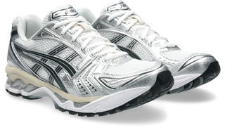 ASICS GEL-KAYANO 14 in White/Graphite Grey with layered upper and GEL cushioning.