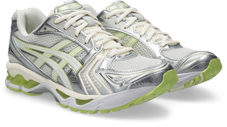ASICS GEL-KAYANO 14 sneakers in Cream and Pistachio colorway with two-tone underlays and GEL® technology cushioning