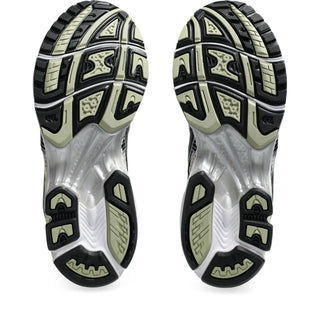 Close-up of a pair of running shoes with focus on the sole design.