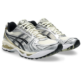 Pair of silver and black running shoes on a white background