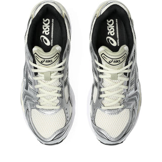 Pair of white and silver Asics running shoes on a white background